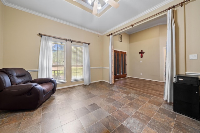 210 Southwood Cir, Baytown, TX 77520 - living area featuring crown molding, a ceiling fan, and dark stone finish floors