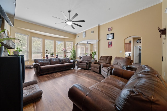 210 Southwood Cir, Baytown, TX 77520 - living room with ceiling fan, arched walkways, ornate columns, ornamental molding, and hardwood / wood-style floors