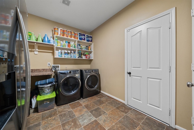 210 Southwood Cir, Baytown, TX 77520 - washroom featuring washer and clothes dryer and dark stone finish flooring