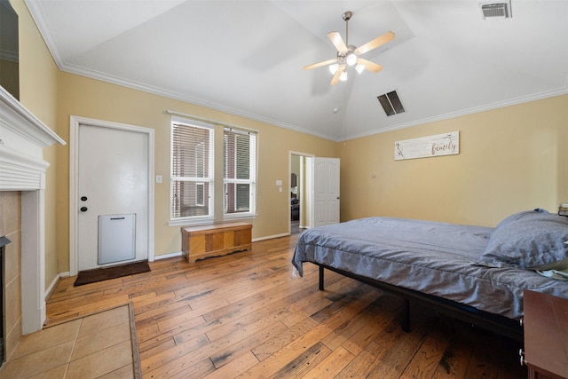 210 Southwood Cir, Baytown, TX 77520 - bedroom with lofted ceiling, light wood-style flooring, ornamental molding, and a ceiling fan