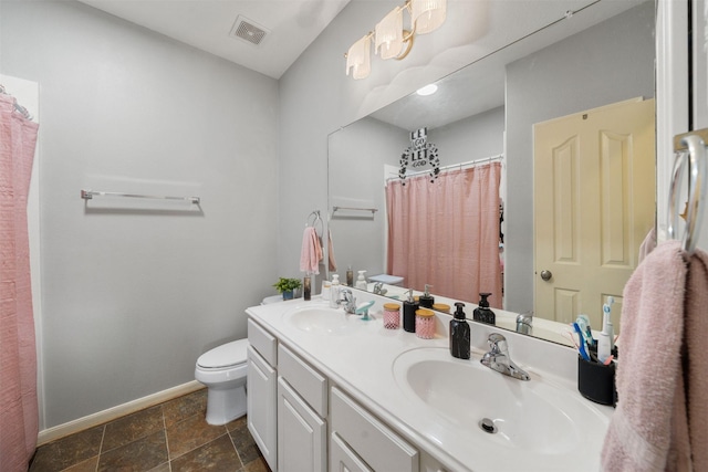 210 Southwood Cir, Baytown, TX 77520 - bathroom with double vanity, stone finish floors, and a shower with shower curtain
