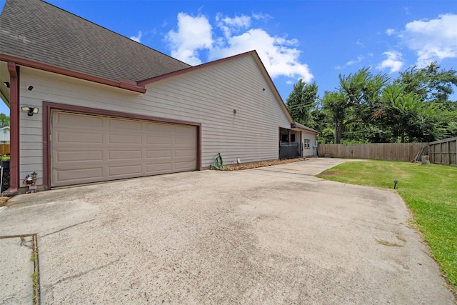 210 Southwood Cir, Baytown, TX 77520 - view of side of property with driveway and a shingled roof