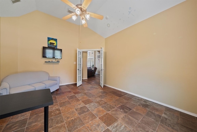 210 Southwood Cir, Baytown, TX 77520 - living area featuring a ceiling fan, dark stone finish flooring, and high vaulted ceiling