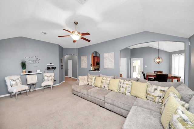 118 Long Canyon Ln, Richmond, TX 77469 - carpeted living room with arched walkways, vaulted ceiling, and ceiling fan
