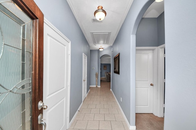118 Long Canyon Ln, Richmond, TX 77469 - hallway featuring attic access, arched walkways, and light tile patterned floors