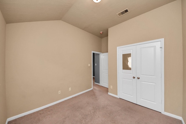 118 Long Canyon Ln, Richmond, TX 77469 - unfurnished bedroom with carpet flooring, vaulted ceiling, and a closet