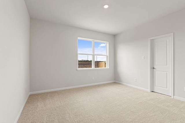 7503 Thrips Ln, Richmond, TX 77469 - carpeted empty room featuring baseboards and recessed lighting
