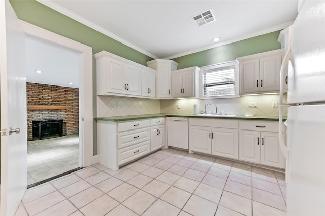 4701 Avenue N 1/2 Ave N 1/2, Galveston, TX 77551 - kitchen featuring white appliances, backsplash, white cabinets, ornamental molding, and recessed lighting