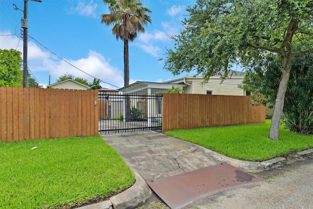 4701 Avenue N 1/2 Ave N 1/2, Galveston, TX 77551 - gate featuring a fenced front yard