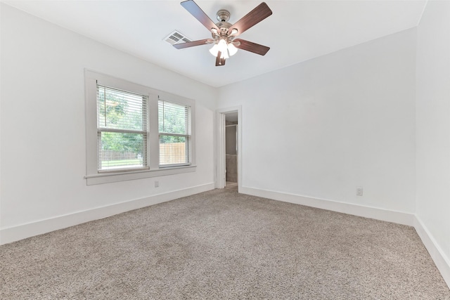 4701 Avenue N 1/2 Ave N 1/2, Galveston, TX 77551 - spare room featuring light carpet and a ceiling fan