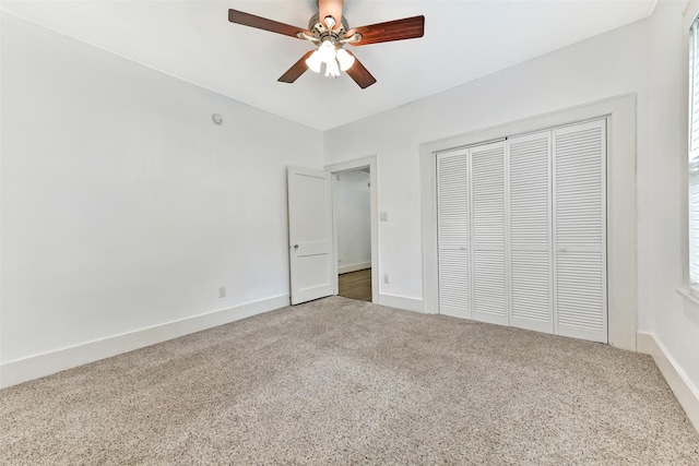 4701 Avenue N 1/2 Ave N 1/2, Galveston, TX 77551 - unfurnished bedroom featuring carpet flooring, a closet, and a ceiling fan