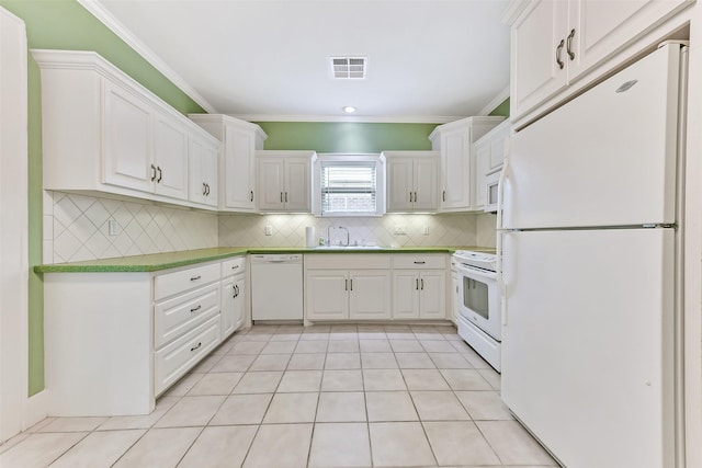 4701 Avenue N 1/2 Ave N 1/2, Galveston, TX 77551 - kitchen featuring white appliances, ornamental molding, tasteful backsplash, and white cabinets