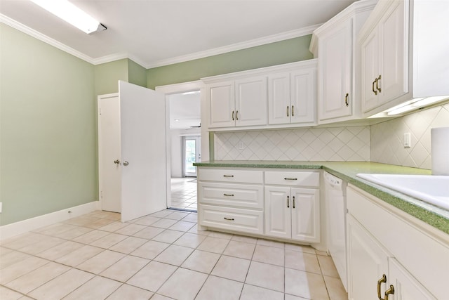 4701 Avenue N 1/2 Ave N 1/2, Galveston, TX 77551 - kitchen with white cabinetry, tasteful backsplash, light tile patterned floors, and crown molding
