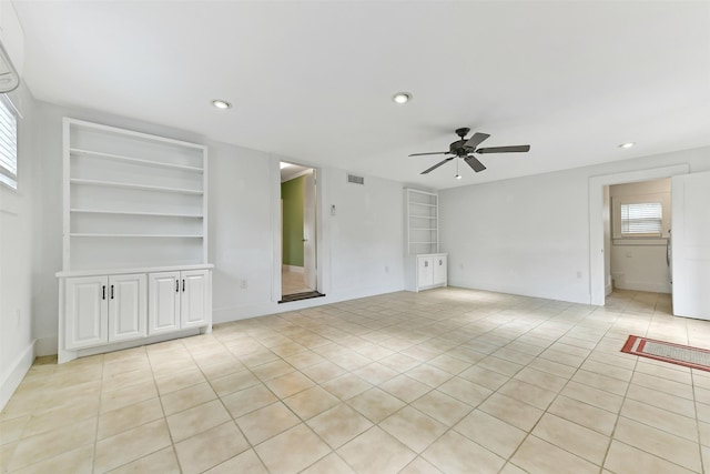 4701 Avenue N 1/2 Ave N 1/2, Galveston, TX 77551 - empty room featuring a ceiling fan, recessed lighting, light tile patterned flooring, and built in features