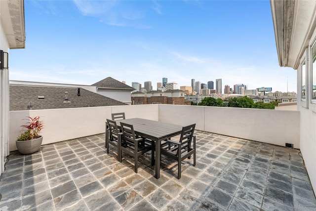 1822 Mcilhenny St Unit A, Houston, TX 77004 - view of patio featuring a skyline view and outdoor dining area