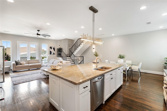 1822 Mcilhenny St Unit A, Houston, TX 77004 - kitchen featuring stainless steel dishwasher, ceiling fan, an island with sink, dark wood-type flooring, and white cabinetry