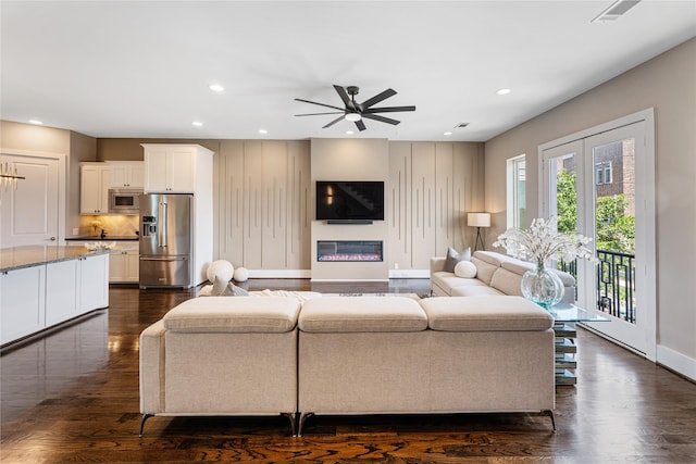 1822 Mcilhenny St Unit A, Houston, TX 77004 - living room with recessed lighting, ceiling fan, dark wood-type flooring, and a glass covered fireplace