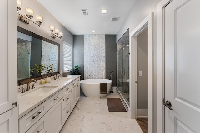 1822 Mcilhenny St Unit A, Houston, TX 77004 - full bath featuring a soaking tub, double vanity, a shower stall, marble finish floors, and recessed lighting