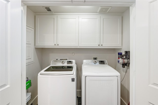1822 Mcilhenny St Unit A, Houston, TX 77004 - laundry area with separate washer and dryer and cabinet space