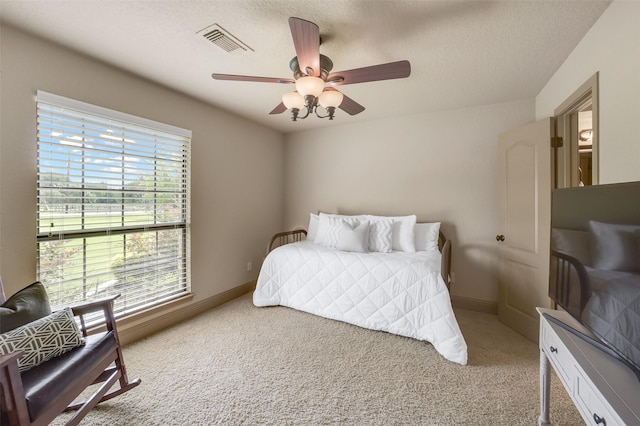 18120 County Road 127, Pearland, TX 77581 - carpeted bedroom with a textured ceiling and ceiling fan