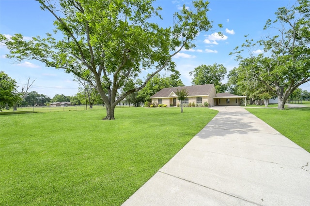 18120 County Road 127, Pearland, TX 77581 - view of front of house with a carport, concrete driveway, and a front yard