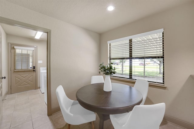 18120 County Road 127, Pearland, TX 77581 - dining area with washer / clothes dryer, light tile patterned floors, and recessed lighting