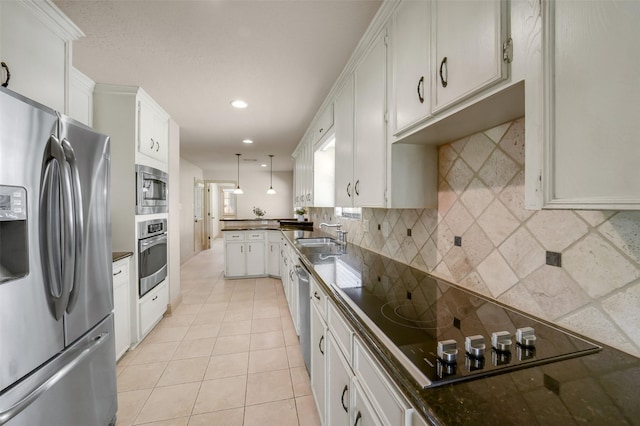 18120 County Road 127, Pearland, TX 77581 - kitchen featuring appliances with stainless steel finishes, dark countertops, tasteful backsplash, light tile patterned floors, and recessed lighting