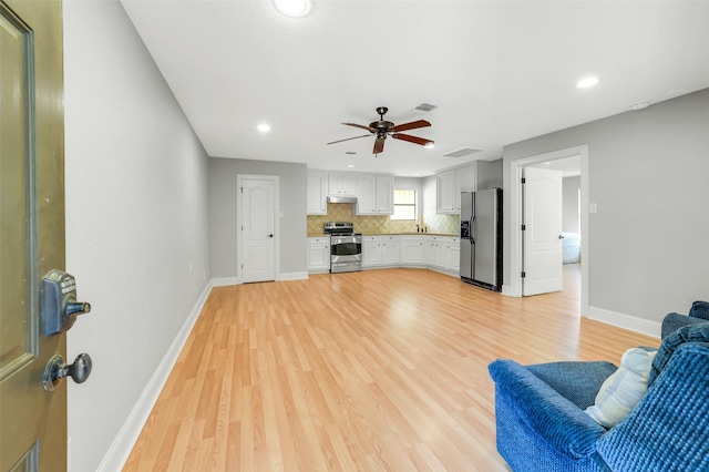 18120 County Road 127, Pearland, TX 77581 - unfurnished living room featuring light wood-style floors, recessed lighting, and ceiling fan