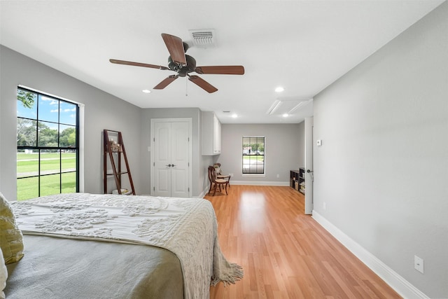 18120 County Road 127, Pearland, TX 77581 - bedroom featuring access to outside, light wood finished floors, recessed lighting, ceiling fan, and a closet