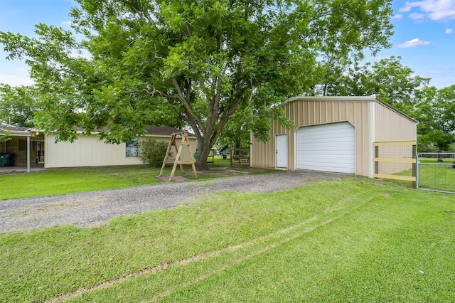 18120 County Road 127, Pearland, TX 77581 - view of front of property featuring a garage, an outbuilding, and driveway