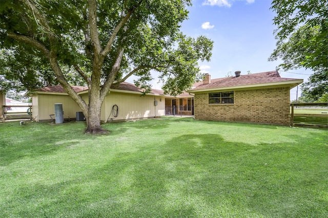 18120 County Road 127, Pearland, TX 77581 - rear view of property with a chimney and brick siding