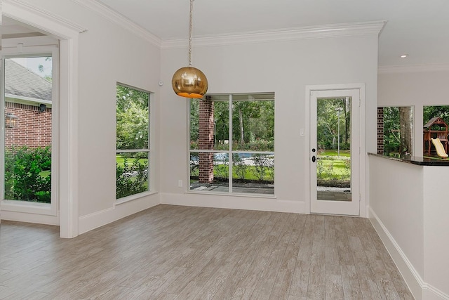 25 Red Sable Pt, The Woodlands, TX 77380 - unfurnished dining area featuring crown molding, wood finished floors, and healthy amount of natural light