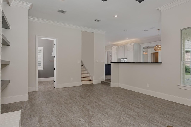 25 Red Sable Pt, The Woodlands, TX 77380 - unfurnished living room featuring crown molding, stairway, light wood-style flooring, and recessed lighting