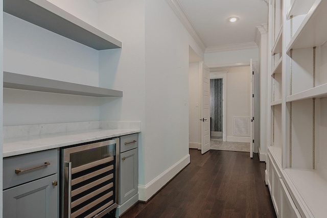 25 Red Sable Pt, The Woodlands, TX 77380 - bar area featuring wine cooler, ornamental molding, and dark wood-style flooring