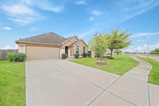 30104 Prairie Creek Ct, Brookshire, TX 77423 - view of front of house featuring brick siding, a garage, driveway, and roof with shingles