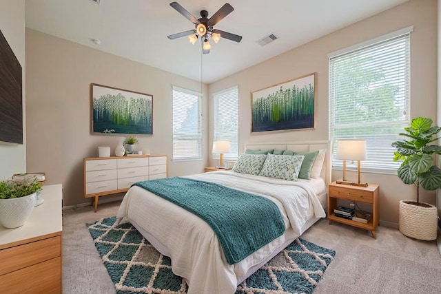 16747 Highland Country Dr, Cypress, TX 77433 - bedroom with light colored carpet, multiple windows, and ceiling fan