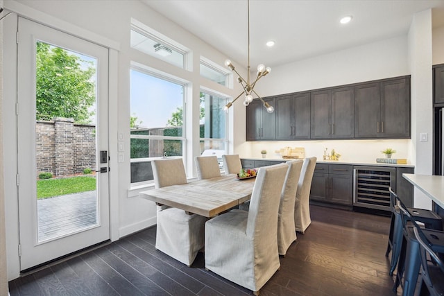 3116 Somerset Levens Ln, Houston, TX 77055 - dining space featuring wine cooler, plenty of natural light, recessed lighting, and dark wood finished floors