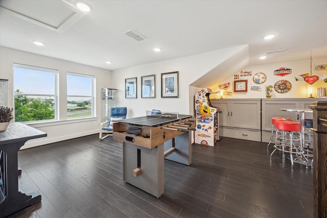 3116 Somerset Levens Ln, Houston, TX 77055 - game room featuring dark wood-type flooring, recessed lighting, a wood stove, and attic access