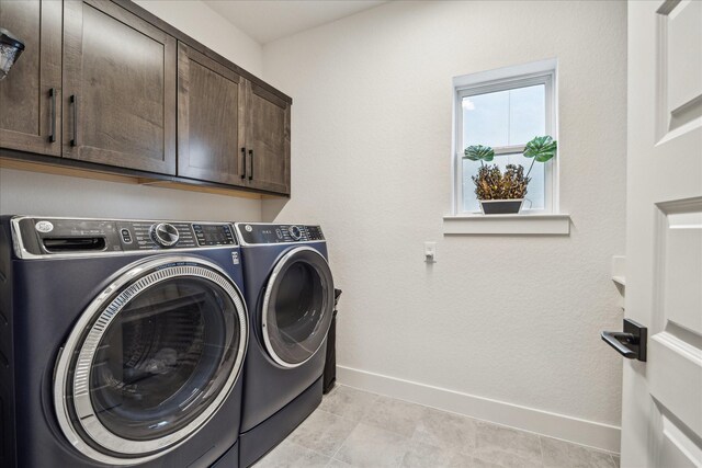 3116 Somerset Levens Ln, Houston, TX 77055 - laundry room featuring cabinet space and washing machine and dryer