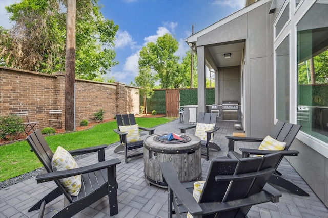 3116 Somerset Levens Ln, Houston, TX 77055 - fenced backyard with a fire pit, a patio, and grilling area