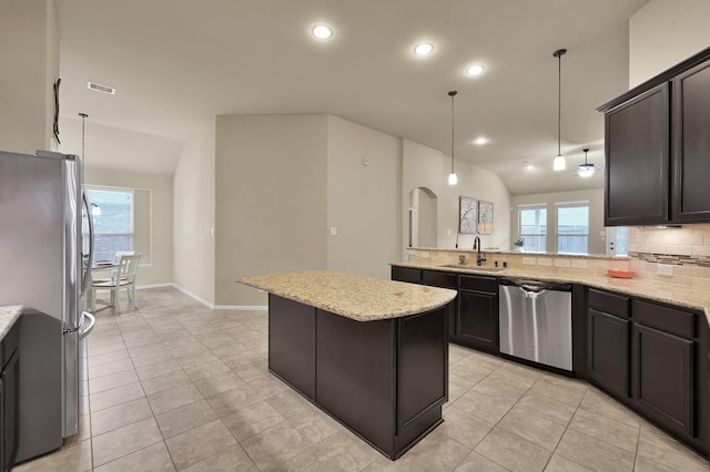7610 Willow School Dr, Spring, TX 77389 - kitchen featuring stainless steel appliances, light tile patterned floors, healthy amount of natural light, and recessed lighting