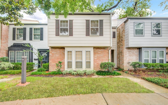 14123 Misty Meadow Ln, Houston, TX 77079 - view of property featuring a front yard and brick siding