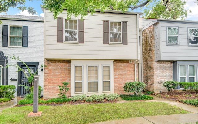 14123 Misty Meadow Ln, Houston, TX 77079 - view of property with brick siding and a front yard