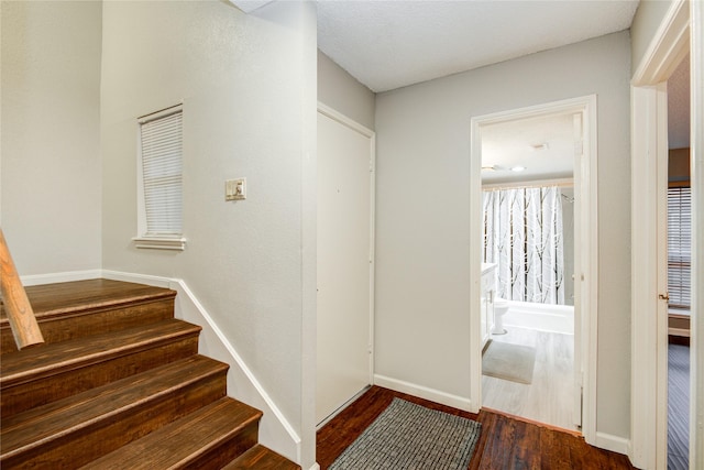 14123 Misty Meadow Ln, Houston, TX 77079 - stairs with wood finished floors and baseboards