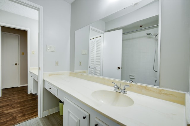14123 Misty Meadow Ln, Houston, TX 77079 - full bath with vanity, a tile shower, and wood finished floors
