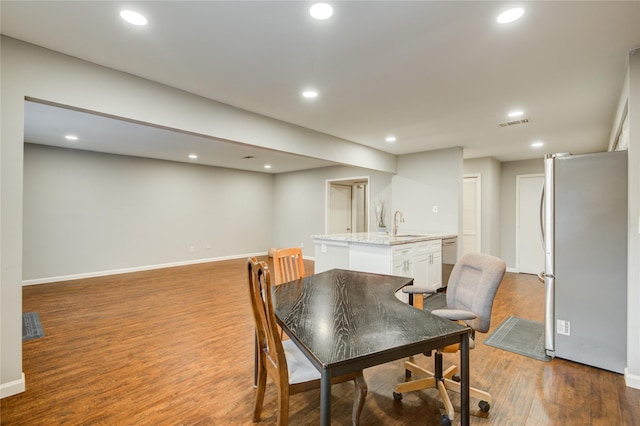 14123 Misty Meadow Ln, Houston, TX 77079 - dining space featuring wood finished floors and recessed lighting