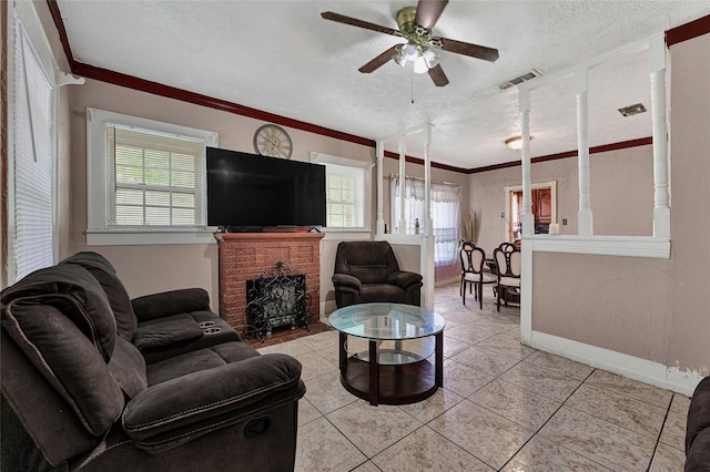 7201 Eden St, Houston, TX 77012 - living area featuring a textured ceiling, a ceiling fan, light tile patterned floors, ornamental molding, and a fireplace