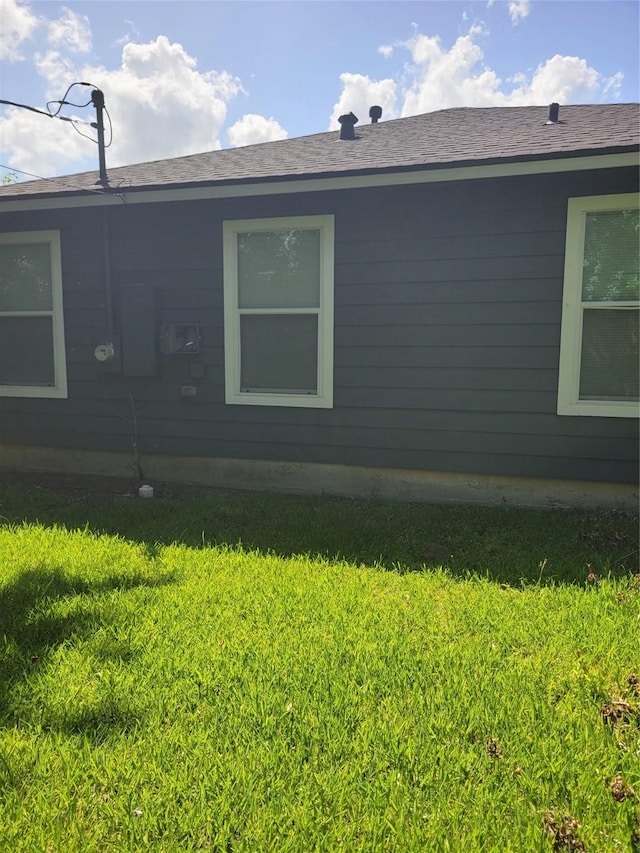 1040 E 18th St, Port Arthur, TX 77640 - view of home's exterior with a lawn