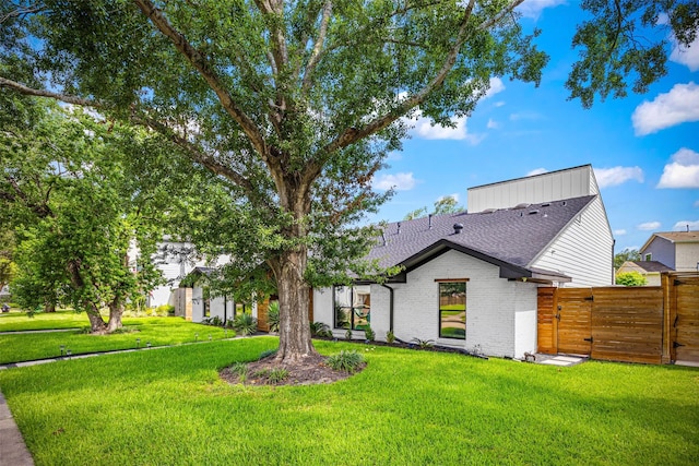 5122 Glenmeadow Dr, Houston, TX 77096 - back of house featuring a gate, roof with shingles, and brick siding