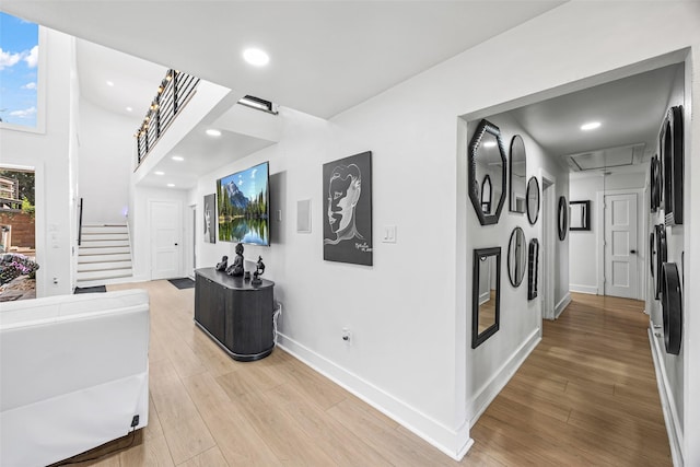 5122 Glenmeadow Dr, Houston, TX 77096 - corridor with attic access, light wood-style flooring, stairs, and recessed lighting